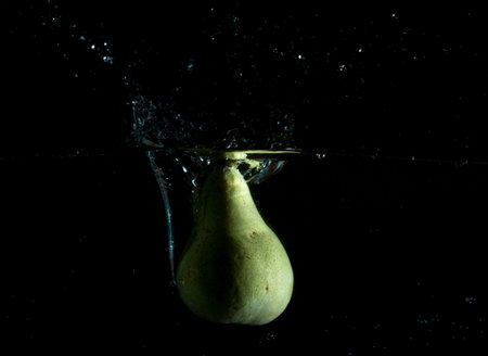 Pear water splash. High speed photography.の写真素材