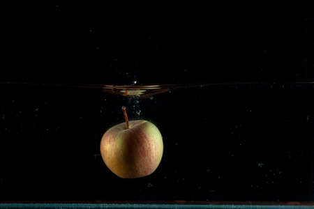 Apple water splash. High speed photography.の写真素材