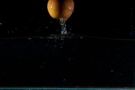 Apple water splash. High speed photography.の写真素材