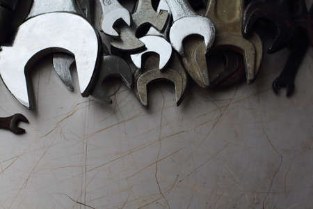 Different wrenches on a metal backgroundの写真素材