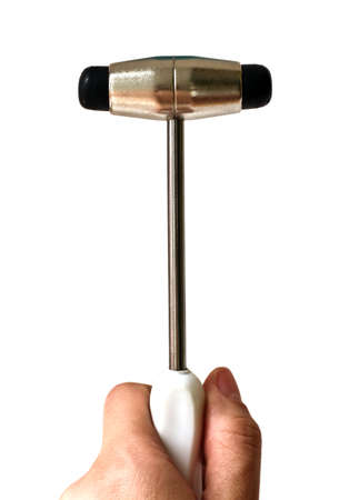 isolated hand holding a neurological hammerの写真素材