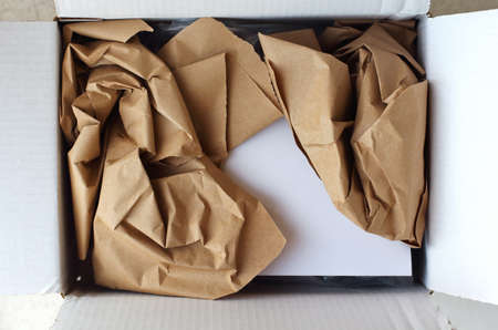 close-up view of opened parcel and gift card insideの写真素材