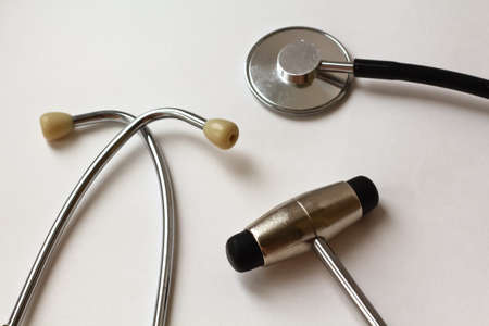 close-up view of stethoscope and neurological hammerの写真素材