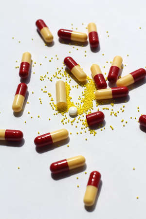 close up of opened capsule, a lot of spilled capsulesの写真素材