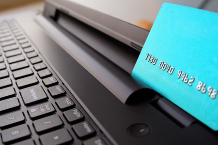 Close up view of credit cards on laptop keyboard. online shopping concept.の写真素材