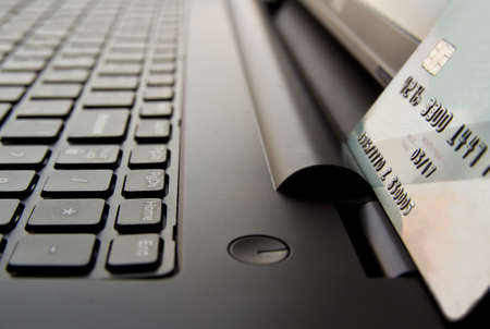 Close up view of credit cards on laptop keyboard. online shopping concept.の写真素材