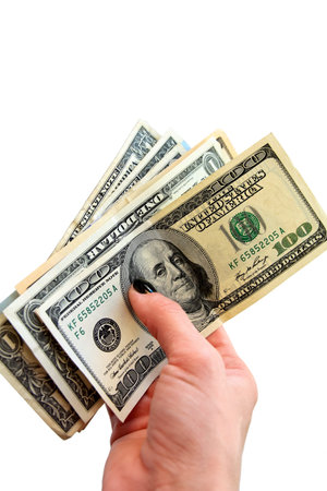 Money in the woman's hand (american dollars), isolated on white background with copy space....