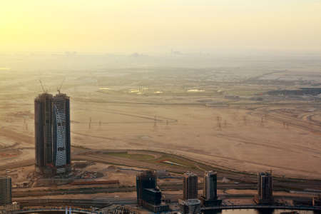 Dubai skyline, United Arab Emirates. construction of skyscrapers in Dubai. desert and city at sunrise twilights.の写真素材