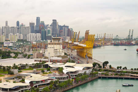 SINGAPORE - JANUARY 13, 2018: Singapore cityscape with modern buildings and Singapore port cargo terminal, top view.のeditorial素材