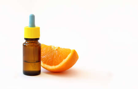 Serum with Vitamin C and oranges. Vitamin C or ascorbic acid is the most effective ingredient in modern anti-aging cosmetics and cosmetology.の写真素材