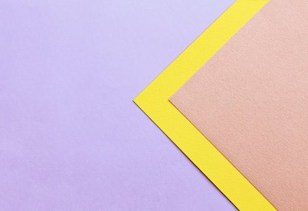 Abstract geometric background in soft pastel trend colors, made from watercolor paper.
