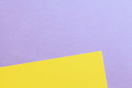 Abstract asymmetric geometric water color paper background in soft pastel purple and yellow trend colors.の写真素材