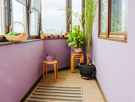 Balcony with table, chairs and flowersの写真素材