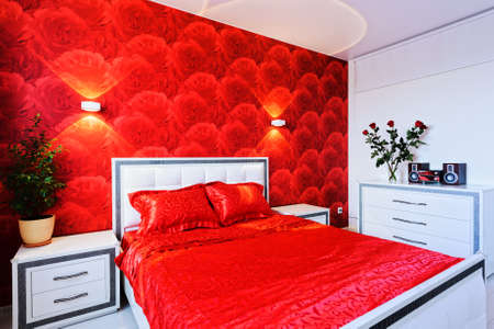 Comfortable and cozy white and red bedroomの写真素材