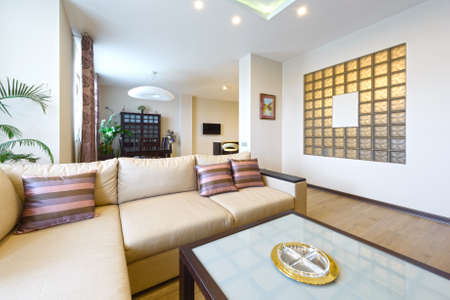 The interior of a beautiful living room with modern furniture in bright colorsの写真素材