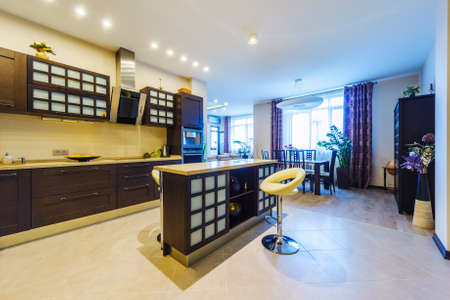 Elegant kitchen with dining area in a modern styleの写真素材