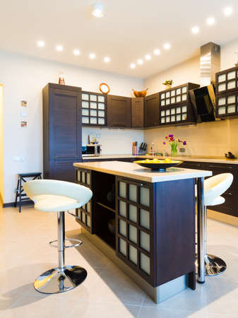 Elegant kitchen with dining area in a modern styleの写真素材