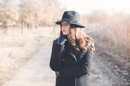 Portrait of a young woman wearing a hatの写真素材