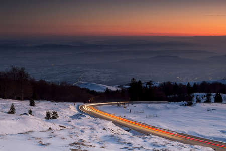 Mountain road on sunsetの写真素材