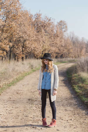 Portrait of a hippie young woman wearing a hatの写真素材