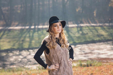 Portrait of a hippie young woman wearing a hatの写真素材