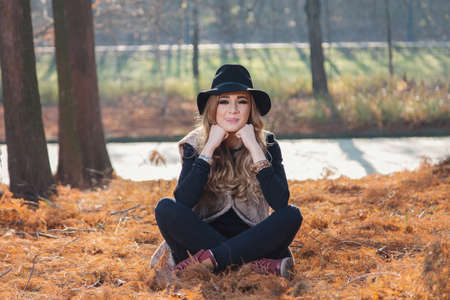 Portrait of a hippie young woman wearing a hatの写真素材