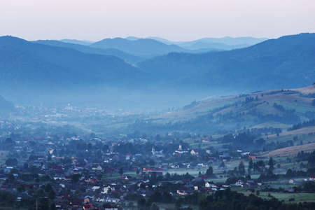 Summer foggy sunrise in the Carpathian hillsの写真素材