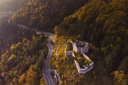 Autumn aerial view of Strmec na Predelu village, at the feet of the Julian Alps, in Triglav national park. Aerial landscape of Fort Predel, in Sloveniaのeditorial素材