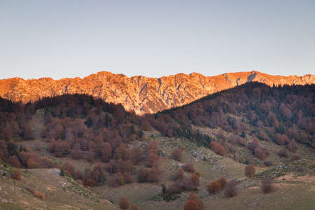 Autumn rural scene of the Romanian village in Transylvania, at the foot of the Carpathian Mountainsの写真素材