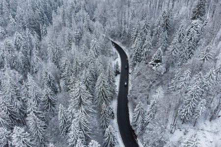 Aerial winter view of the curvy mountain road, in Poiana Brasov
