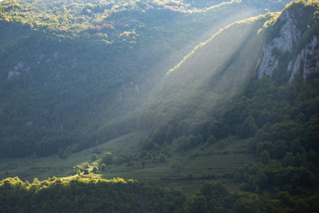 Mountain views with green hills, during spring. Aerial view of Dumesti village from Apuseni Mountains, Romaniaの写真素材