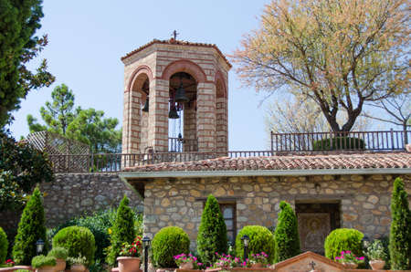 Meteora monastery bell tower with plants with a peacefull atmosphereの写真素材