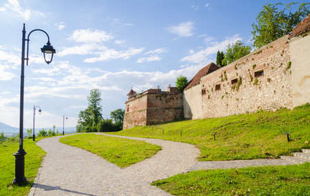 Medieval fortress of Brasov walls in Transylvania region of Romania with high defence walls and towers suggesting the country's rich historic and cultural heritageのeditorial素材