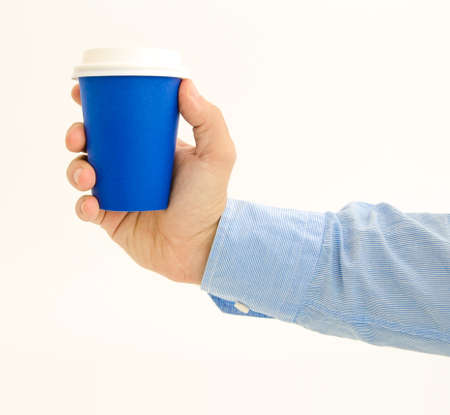 Blue coffee cup to go takeaway being held by a business handの写真素材