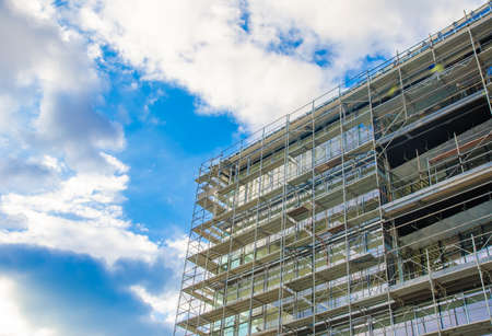 Building under construction on a blue sky sunny dayの写真素材