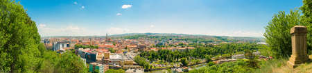 Wide cityscape view of Cluj-Napoca in Transylvania region of Romania on a sunny summer dayの写真素材