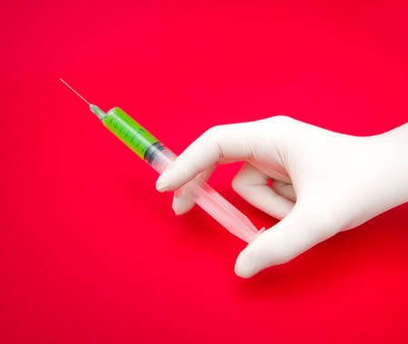 Toxic lethal drugs injection with a red radioactive look suggesting meds and chemicals that are bad for youの写真素材