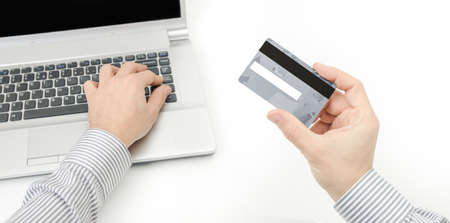 A business man securing a credit card to prevent online bank account from being hackedの写真素材