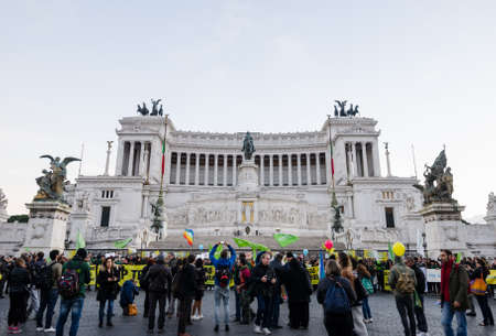 ROME, ITALY - 1 December 2015: Mausoleum of Emmanuel  Vittorio Due II dedicated to the heroes of Italy with a protest or riot in frontのeditorial素材