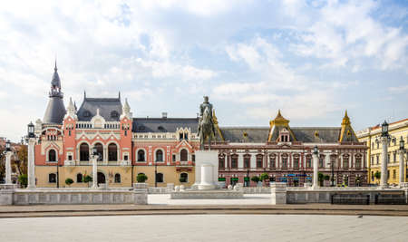 10 September 2016 - Oradea, Romania: Mihai Viteazu (Michael the Brave) Statue in the Unirii SDquare with the Greek-Catholic Episcopal Palace on the background in this wonderful East European cityのeditorial素材
