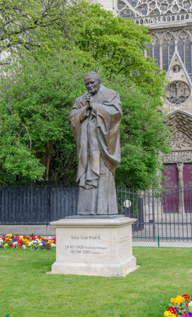 Paris, France - 1 April 2017: Pope John Paul II statue on the south of the Notre Dame de Paris...