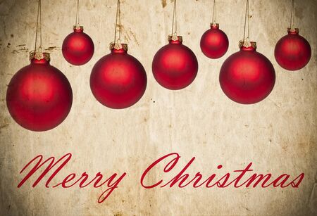 Grunge Christmas background with red Christmas ornamentsの写真素材