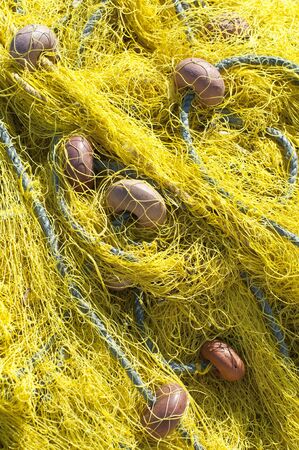 Yellow fishing net background の写真素材