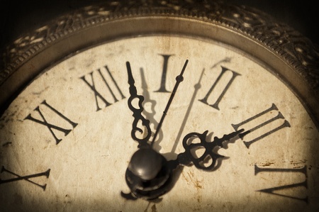 Antique clock on grunge backgroundの写真素材