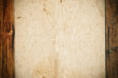 Grunge paper on wood background