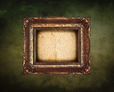 Antique picture frame on grunge wallの写真素材