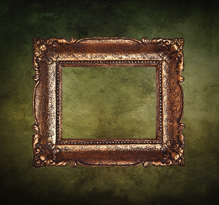 Antique picture frame on grunge wallの写真素材