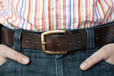 Jeans leather belt and shirt with hands in pocket - clothing detailの写真素材