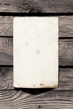 Empty note on wooden background の写真素材