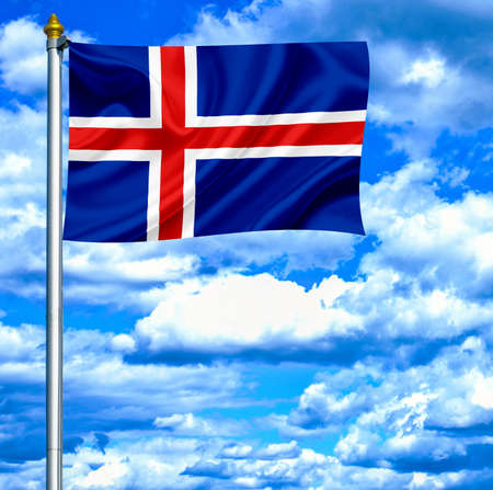 Iceland waving flag against blue skyの写真素材